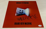 SAUL MILTON SIGNED CHASE & STATUS BRAND NEW MACHINE 12X12 PHOTO ACOA