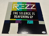 REZZ SIGNED THE SILENCE IS DEAFENING 12X12 PHOTO ACOA