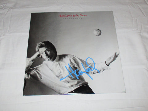 HUEY LEWIS SIGNED SMALL WORLD VINYL RECORD